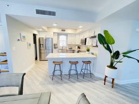 Light and bright kitchen with breakfast bar seating