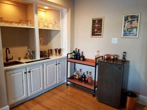 Media room also features wet bar, refrigerator and rolling cocktail cart