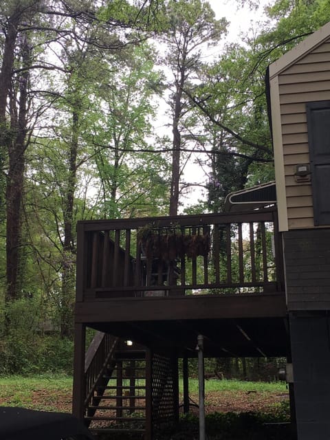 Large deck with BBQ and outdoor seating for four.