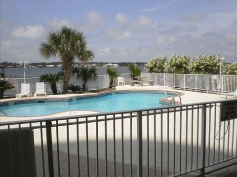 Pool area with pier, gazebo and barbecue grill area