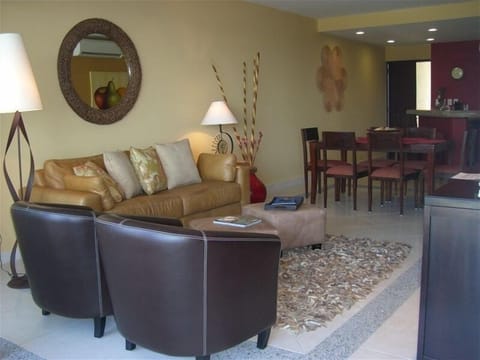 A Comfortable Living Space Overlooks With Opening Wall to the Balcony