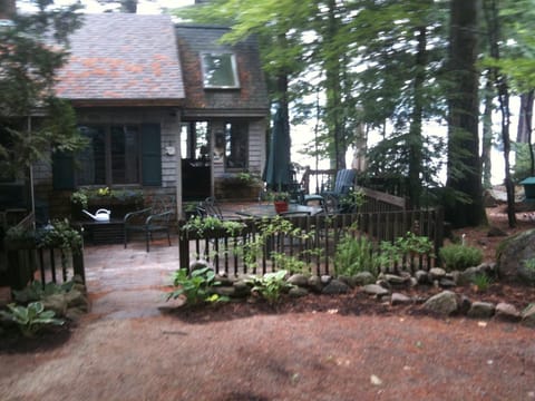 Rear sitting area from driveway. Sun arrives around noon.