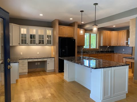 Kitchen with island, office, double ovens and chef style gas Bosch stove top