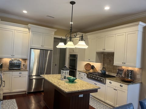 View of kitchen w/Thor 6 burner gas stove, Jenn Aire double ovens & refrigerator
