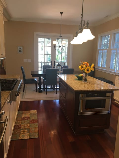Kitchen looking into breakfast room with table for eight or more