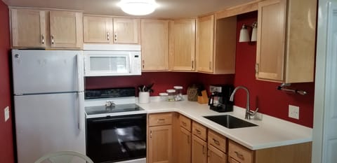 Remodeled, enlarged kitchen.  New cabinets, countertop, fridge, microwave, etc