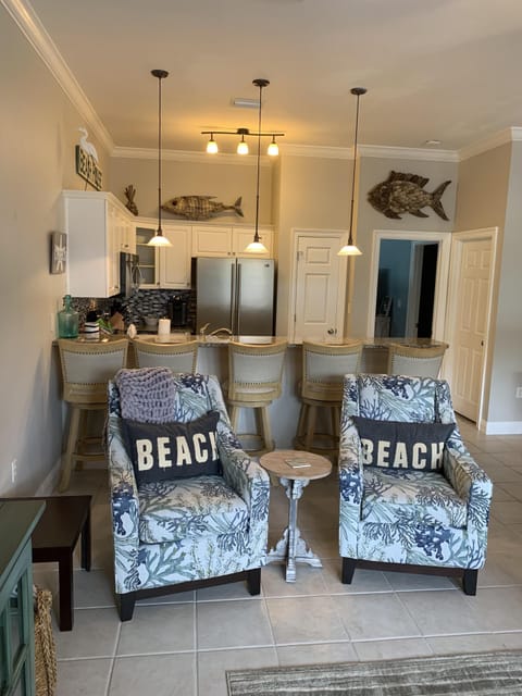 Living room view into kitchen.