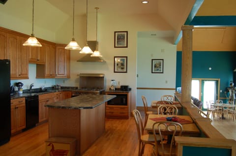 Kitchen and Cafe Tables overlook Dining Room, Bar area, Lower Level
