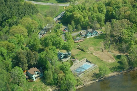 Aerial view: Lake house upper right with twin peaks; tennis court yours to use !