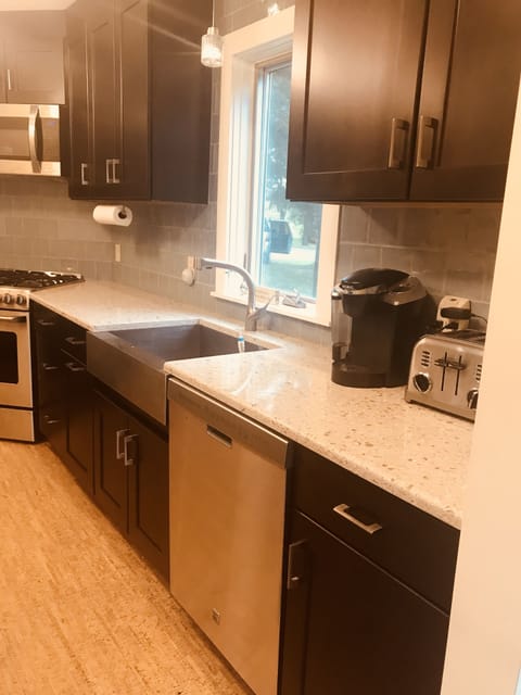 Farmers sink, Keurig machine and dishwasher.