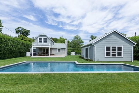 Back yard w/ heated swimming pool, pool house w/ full bath and outdoor shower