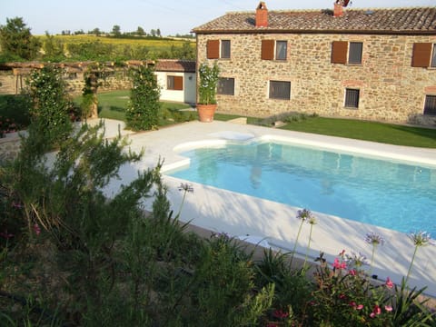 Back of house, with large private pool. Surrounded by fields.