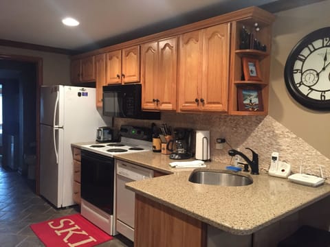 Kitchen - fully stocked! Plenty of dishes, pots, pans, foils, spices etc.