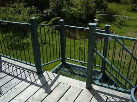 large deck with awning and outside stairway