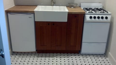 Kitchenette with farmhouse sink - also microwave (not shown)