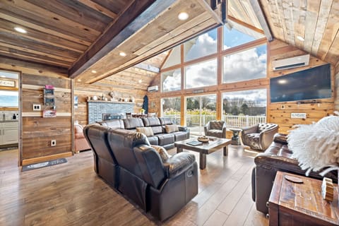 Great Room has a 65" Smart TV, gas fireplace, sectional sofa and more.