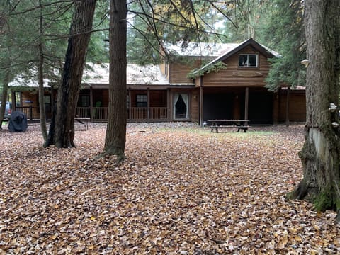Front of house with firepit and picnic table 