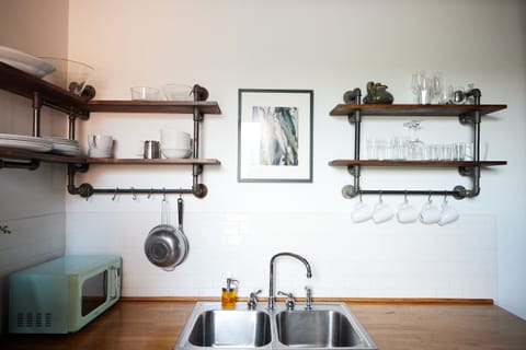 cups, pots, and pans available in the kitchen! 