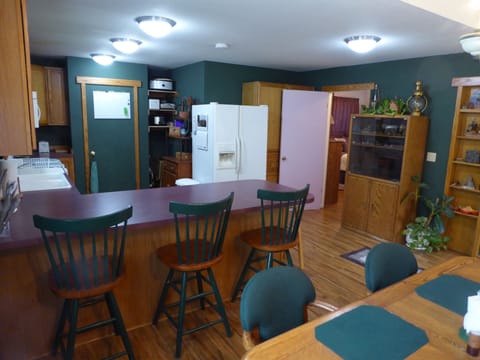 Breakfast bar and oak dining table for six