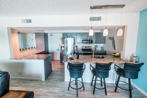 View of the kitchen and convenient breakfast bar from the living room 