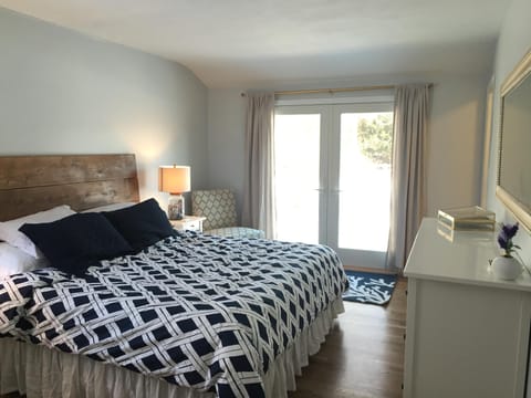 Master bedroom with french doors leading into the backyard