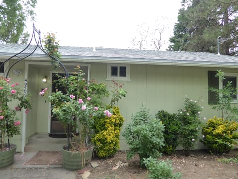Front door to the Bungalow through the rose arch way.