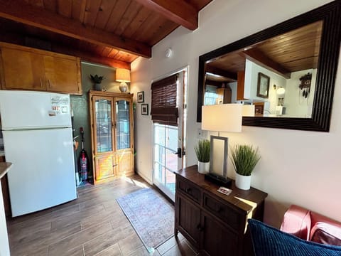 View in Livingroom to front door just steps away to the Pacific Ocean.