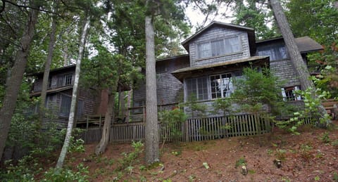 (RENTALS FOR NEXT YEAR BEGIN OCT. 1) The cottage and annex seen from the woods. 