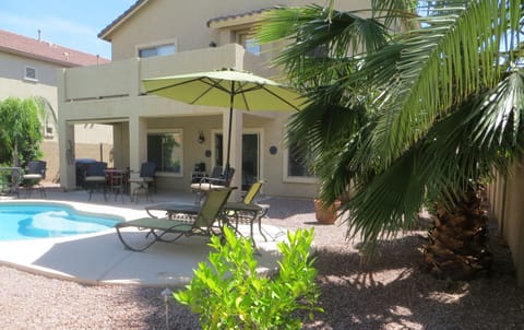 VIEW OF BACK PATIO AND UPPER LEVEL BALCONY