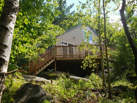 Back deck overlooks wooded mountainside and the 12.5 acre, secluded lake below. 