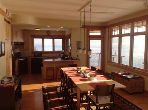 dining room, with kitchen and deck toward the back.