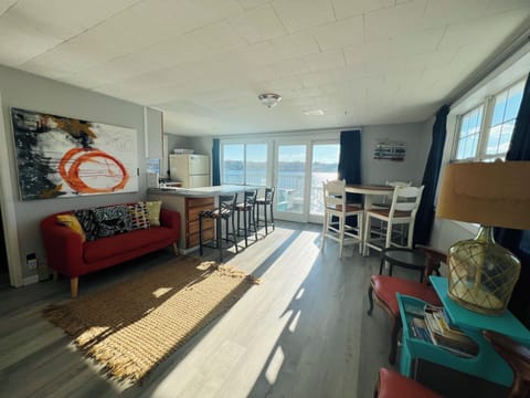 Upper level living room with sleeper couch and gorgeous views of the lake