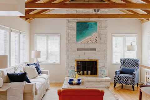 Living room with smart TV and board games. Fireplace is not operational.
