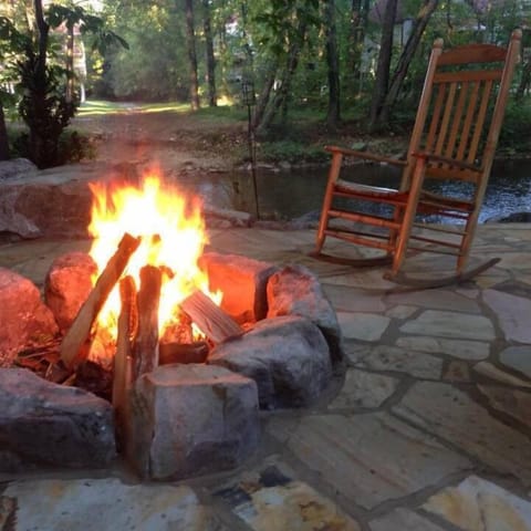 Rock by a warm fire in the outdoor fire pit.