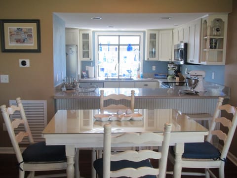 Gathering Table with room for 8 with bar stools