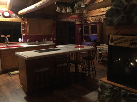 Kitchen with 3 sided gas fireplace. 
