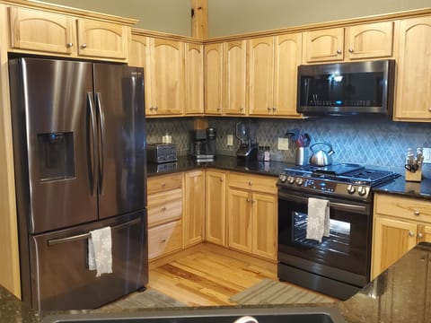Main floor kitchen with new Samsung appliances.