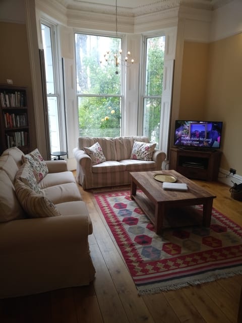 Sitting room with 2 settees, HDTV (shown from position of dining table)