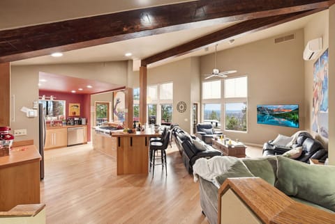 Bright open living space with chef’s kitchen and stunning mountain views 