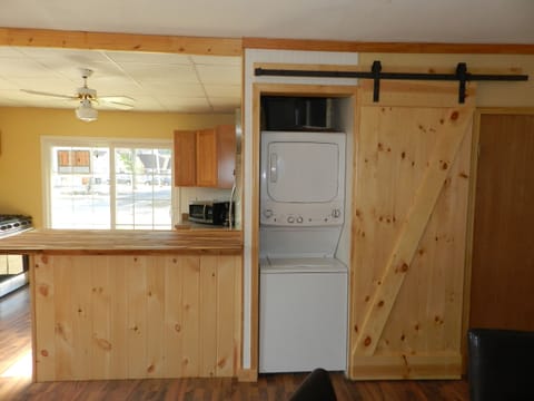 Concealed washer and dryer on 1st floor.