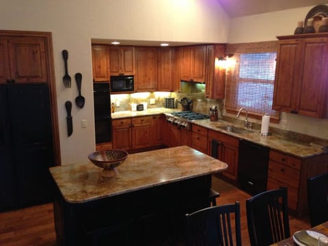 Open gourmet kitchen, island with seating, slab granite, & everything you need!