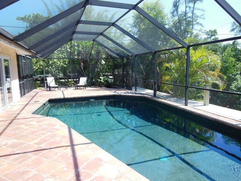 Salt water private pool inside fully screened-in lanai.