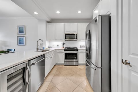 Bright updated kitchen with stainless appliances and wine cooler.