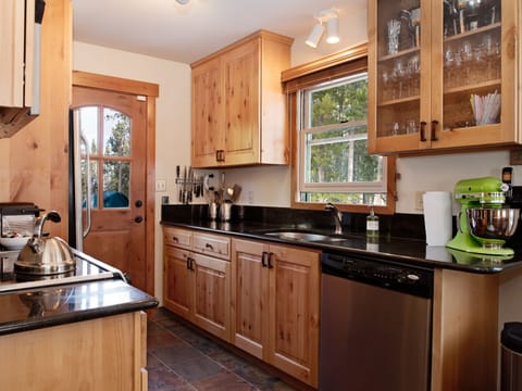 Newly equipped kitchen full of quality bench top appliances and kitchenware