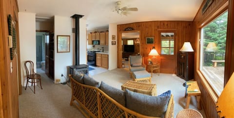 Coming out of the twin bedroom into the living room with electric fireplace.