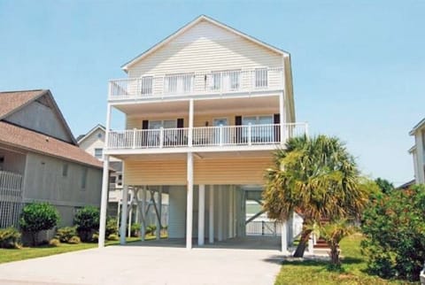 Front view of house.  Plenty of parking under the house and in the driveway.