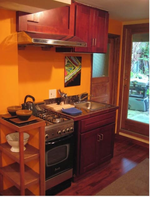 Efficient Kitchen, gas oven range, view of Private Backyard Patio Garden