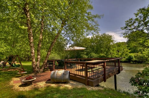 Large deck over the Toccoa river with seating to 
enjoy the view and fish.