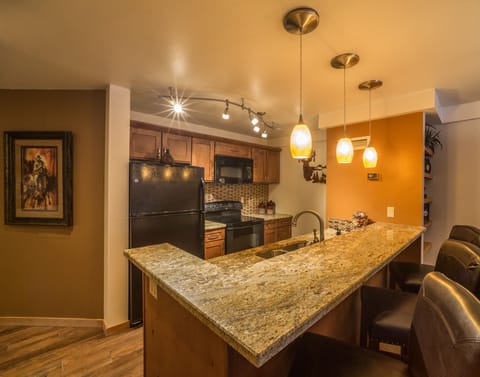 Kitchen includes all major appliances, cooking utensils, microwave, coffee maker