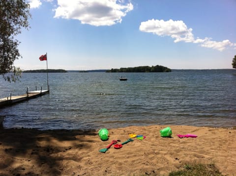 Sandy Beach with Wade-in Shoreline and Floating Dock.